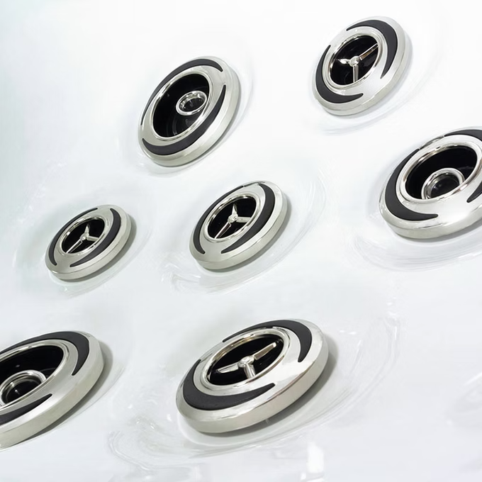 Shiny silver and black mercedes-benz wheel center caps with a three-pointed star emblem.