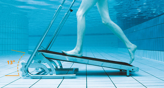 Underwater treadmill with metallic frame and black running belt.