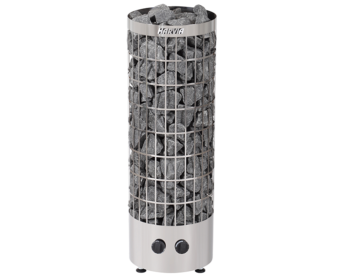 Silver cylindrical sauna heater with a mesh cage filled with dark gray river stones and the brand name ’karva’ engraved on top.