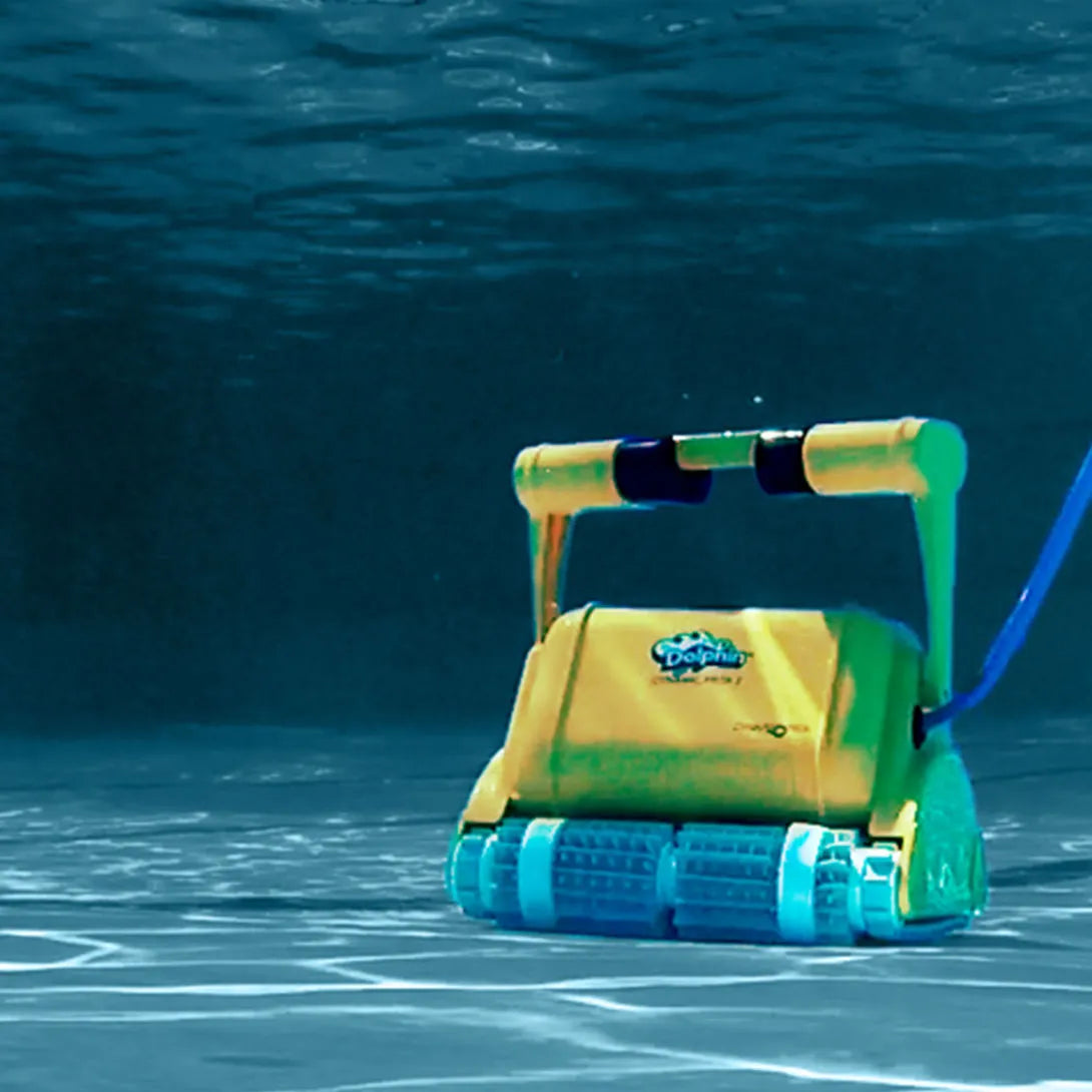Yellow and green robotic pool cleaner with blue wheels, featuring a handle for manual operation.