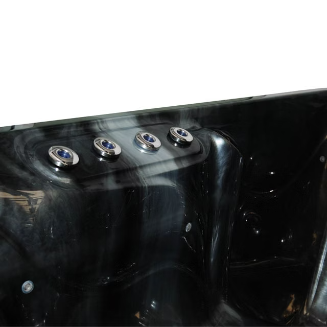 Black hot tub with four silver jet nozzles featuring blue-tinted centers.