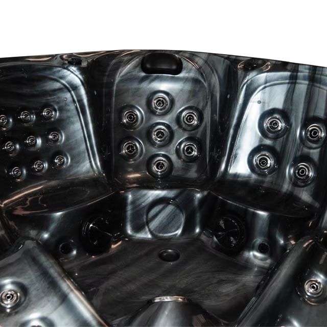 Black hot tub with a glossy, marbled finish and multiple circular jet nozzles.