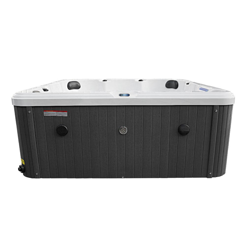 Black and white outdoor hot tub with vertical slat siding.