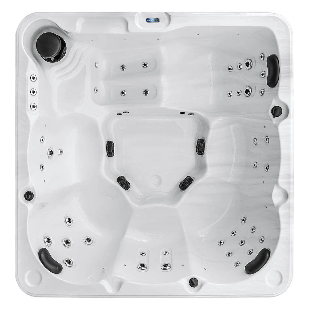 White hot tub with black jets and silver-toned spray nozzles.