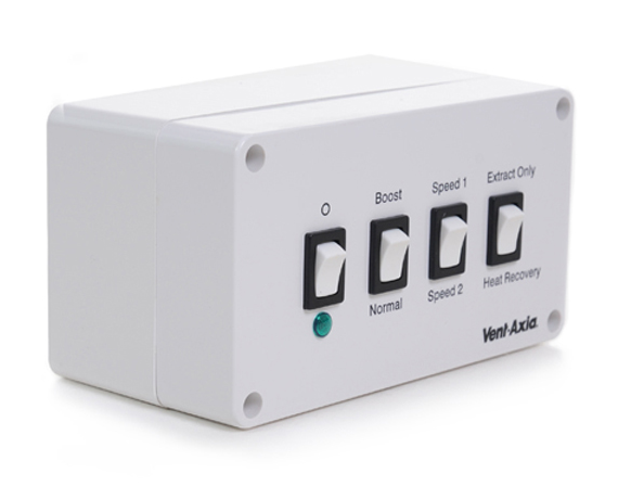 White rectangular vent-axia ventilation control panel with four toggle switches labeled ’o,’ ’boost,’ ’speed 1,’ and ’extract only’ alongside a green indicator light.
