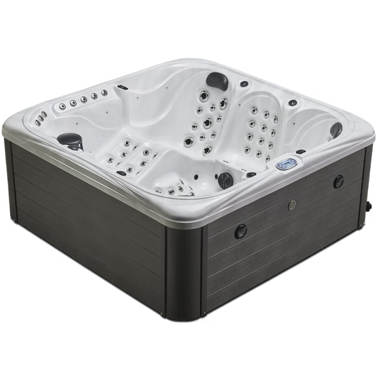 White and gray hot tub with multiple jet nozzles and control panels.