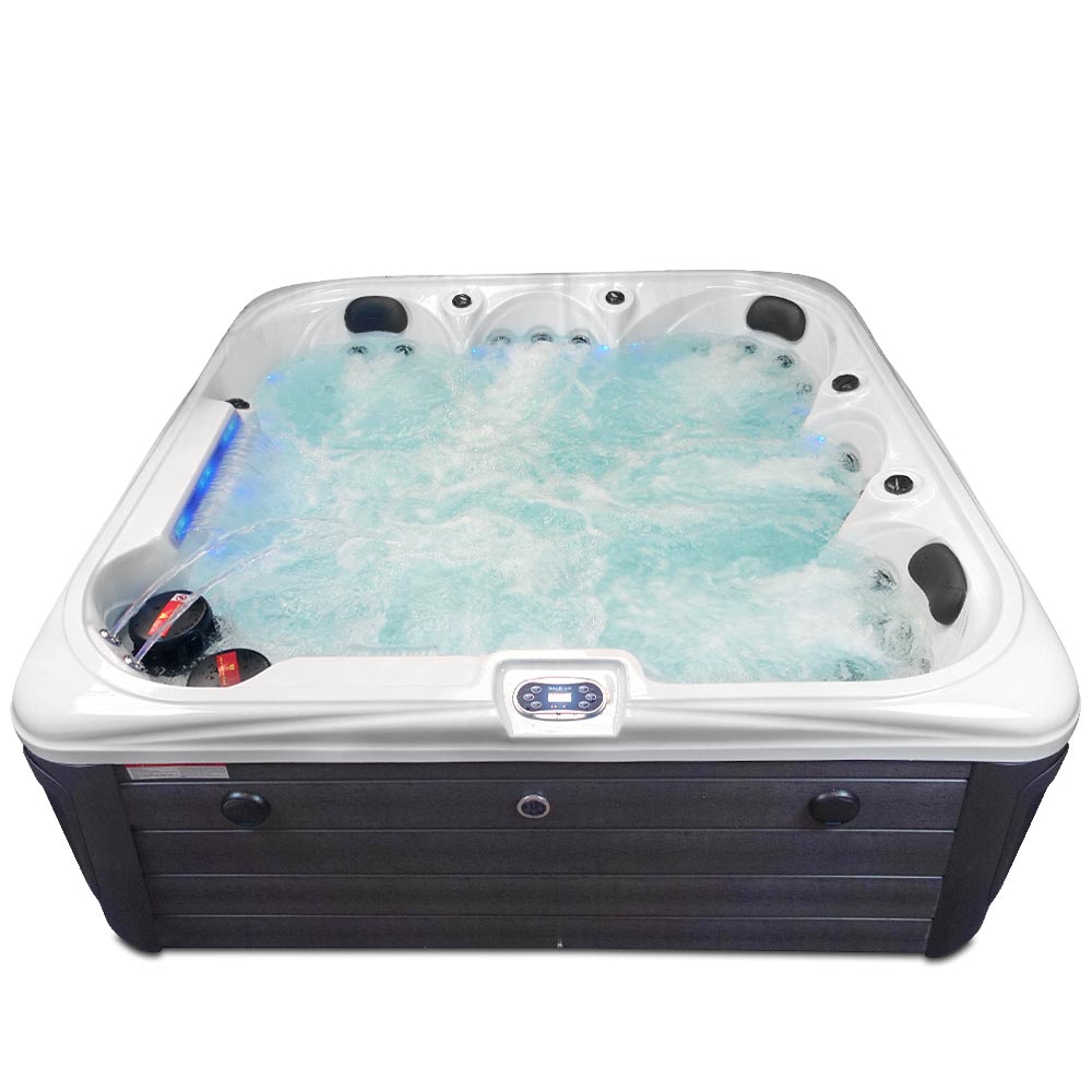 White and black hot tub with blue-lit water jets.
