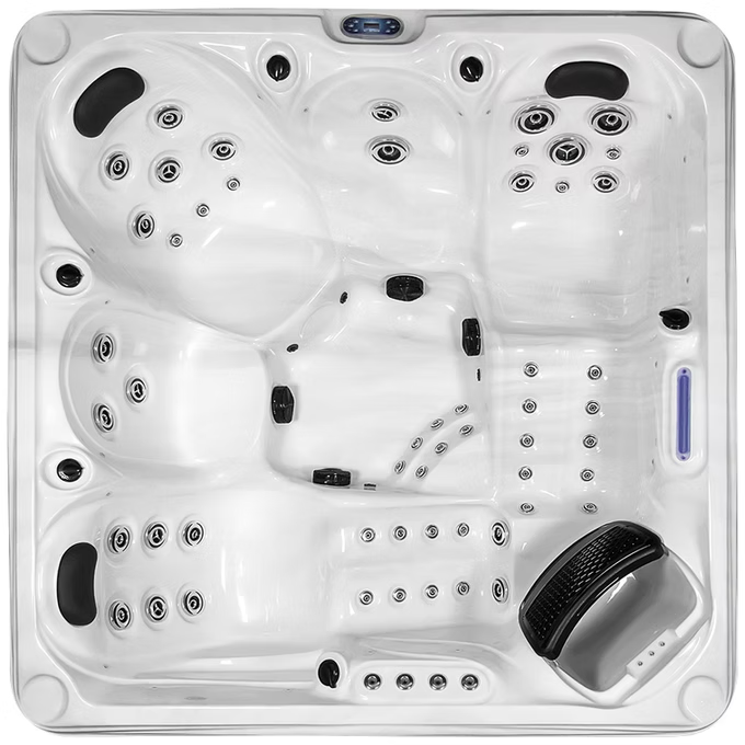 White hot tub with black jets and a textured black footrest.