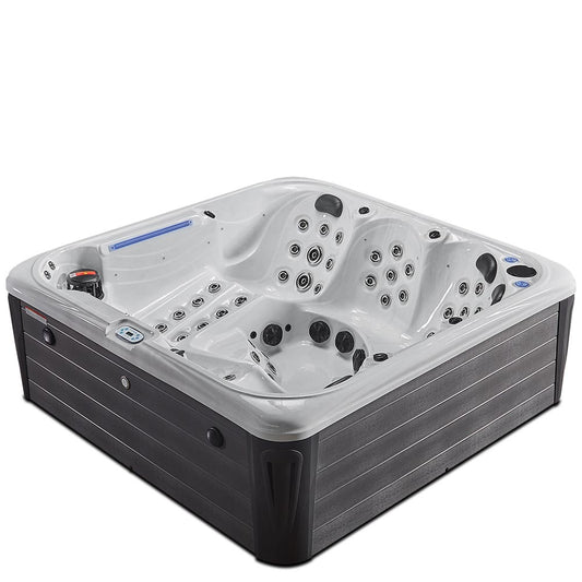 Gray and white hot tub with multiple jet nozzles and a sleek, modern design.