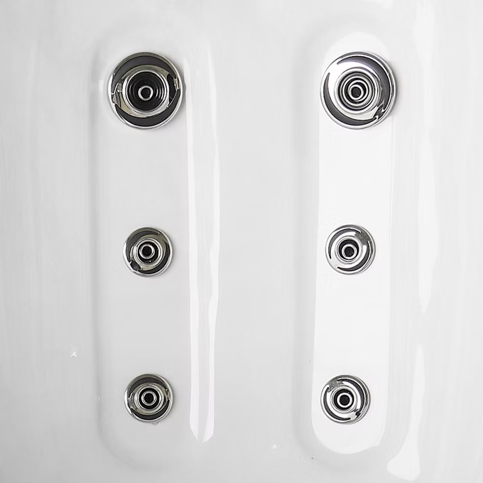 Six chrome-finished jet nozzles arranged in two vertical columns on a white spa surface.