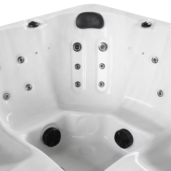 White hot tub with black jets and a central headrest.