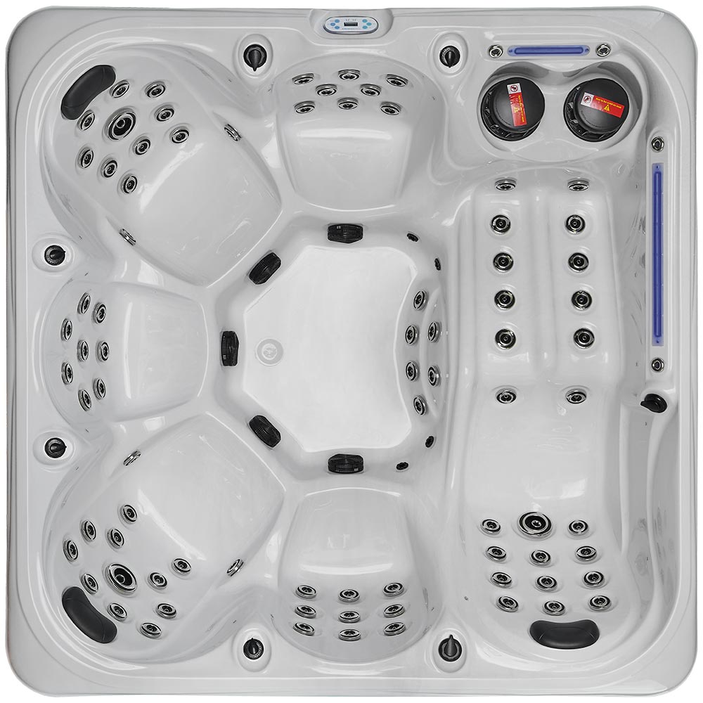 White hot tub with black jets and control panels.