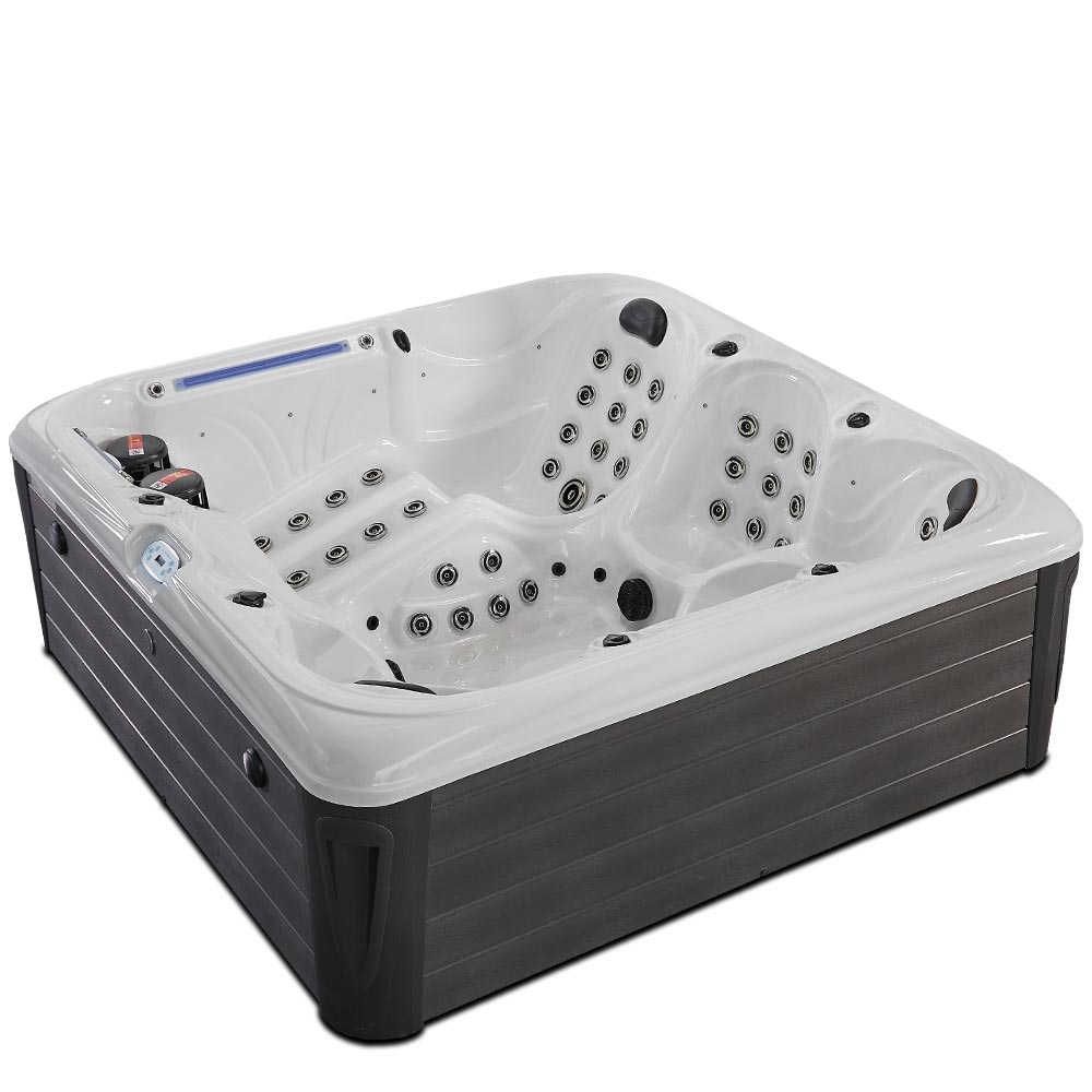 White and dark gray hot tub with multiple jet nozzles for hydrotherapy.