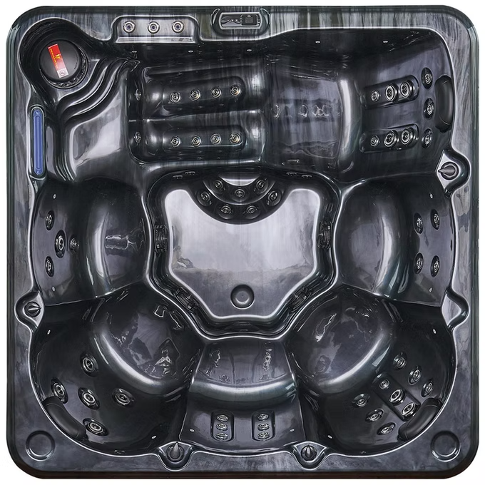 Black hot tub with multiple seating areas and integrated jets.