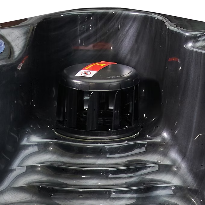 Black plastic jet pump with red and white warning label