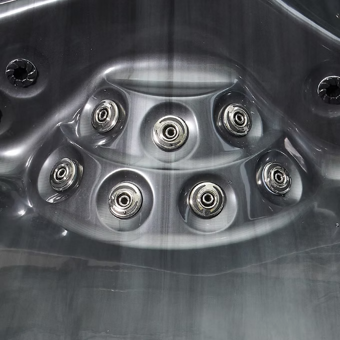 Six chrome-finished jet nozzles embedded in a sleek, dark gray molded plastic panel.