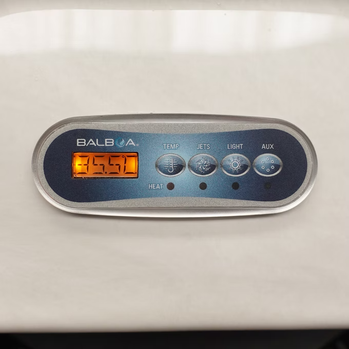 Silver-framed balboa control panel with orange digital display and four circular buttons labeled temp, jets, light, aux.