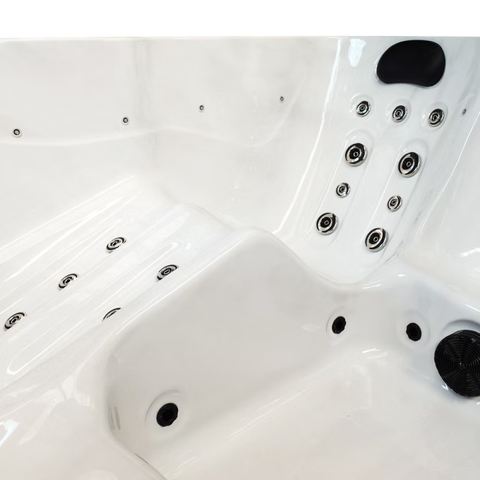 White hot tub with black jet nozzles and a sleek, modern design.