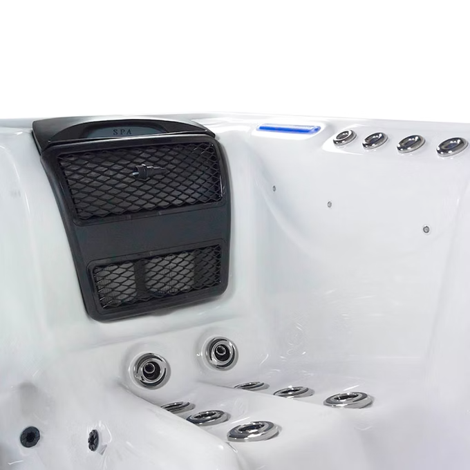 Black mesh-covered control panel with ’spa’ branding on a white hot tub.