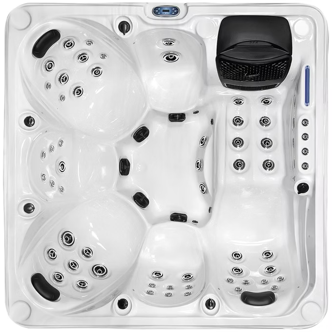 White hot tub with black jets and control panel.