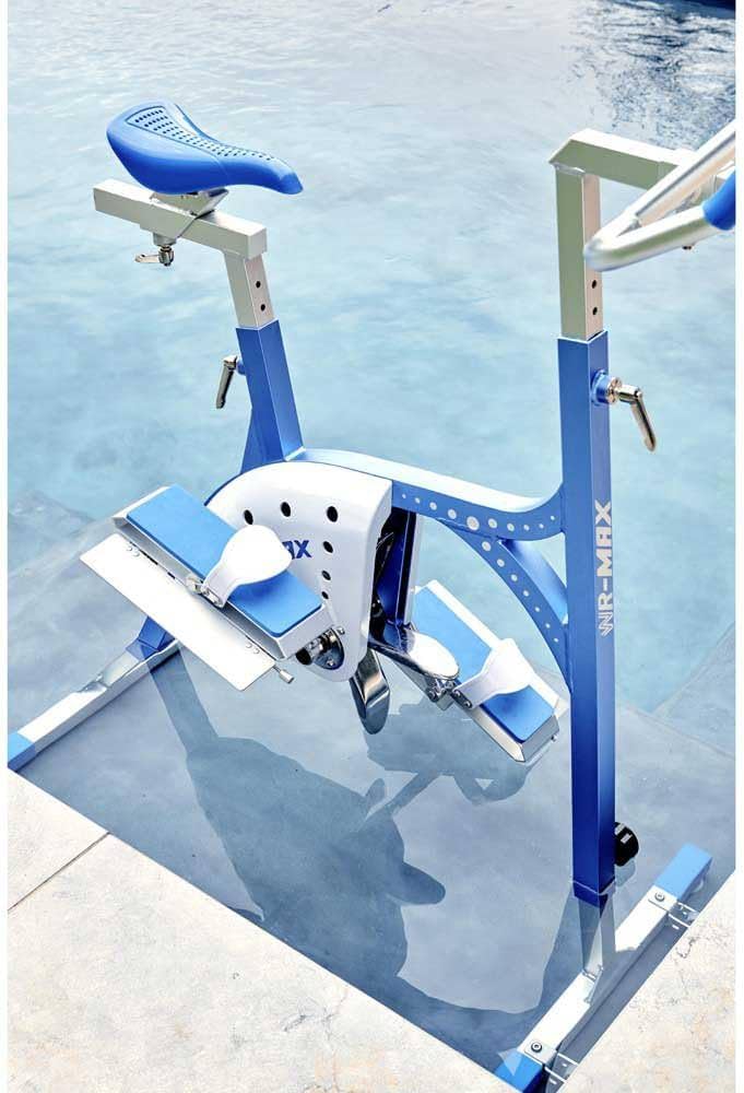 Blue and white aquatic exercise bike with a padded seat, foot pedals, and metal frame.