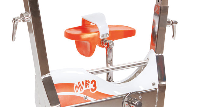 Orange and white stationary bike with chrome metal frame