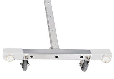 Silver metal floor squeegee with white rubber blades and four small caster wheels.