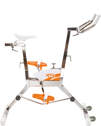 White and orange stationary exercise bike with metallic frame, labeled ’wr5’’ on the side.